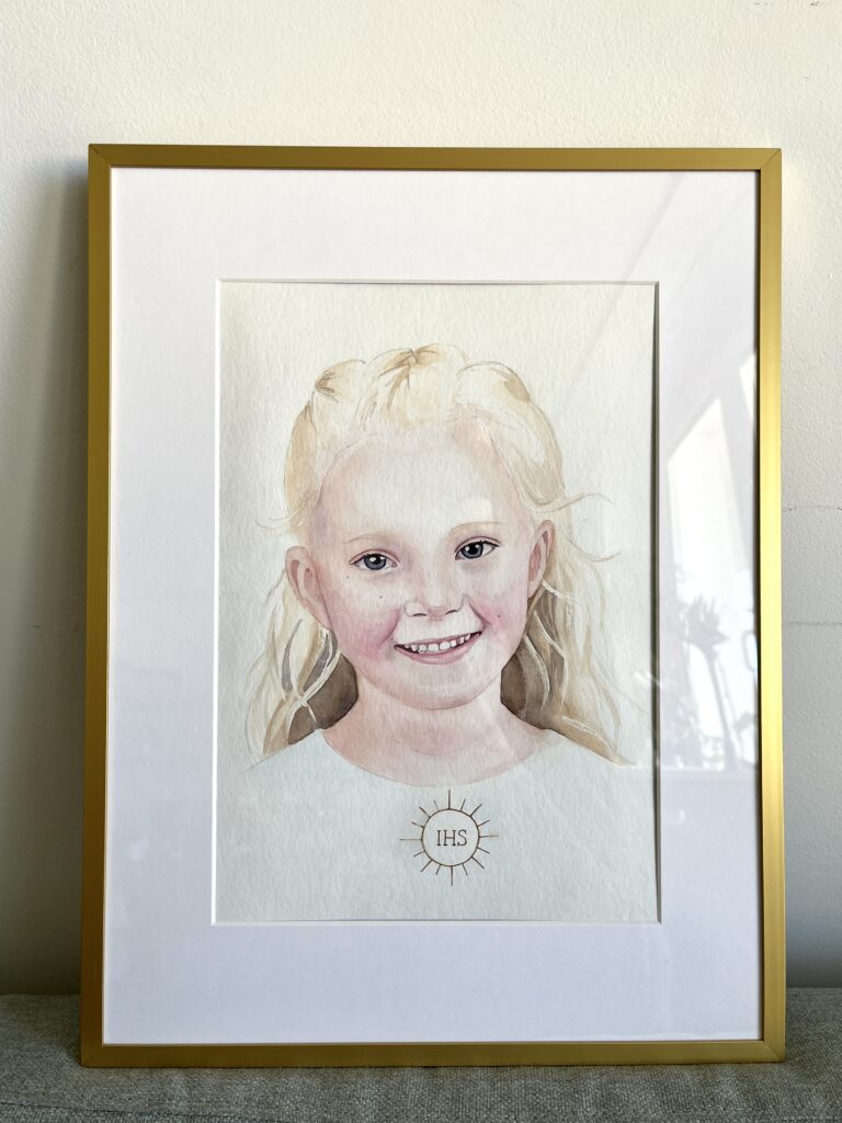 Portret komunijny akwarelą w ramce na ścianie, realizacja Paulina Tomaszewska, Warszawa